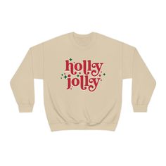 a sweatshirt with the words holly jolly written in red and green stars on it's chest