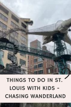 an airplane flying over a city next to tall buildings with text that reads things to do in st louis with kids - chasing wanderland