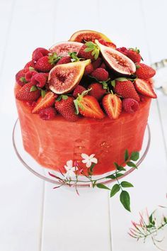 there is a cake with fruit on it