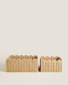 two wicker baskets sitting on top of each other