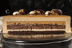 a piece of cake with chocolate and white frosting sitting on top of a table