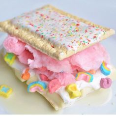 an image of a sandwich made out of ice cream and sprinkles on a plate