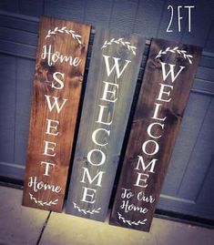 three wooden signs that say welcome, welcome home and welcome to our home on the front porch