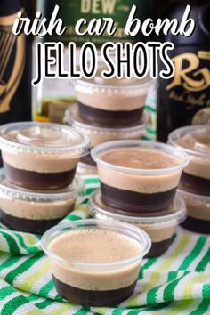 small cups filled with jello shots sitting on top of a green and white towel