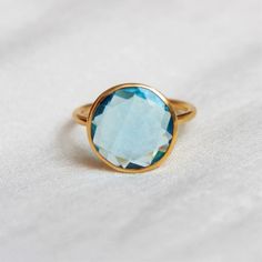 D E T A I L S - Material:  Sterling silver 925Stone:      Blue Topaz Quartz (Lab Created)The fit:     True to US ring size Finish:      Smooth and Gold Plated to a high shineS H I P P I N G & P R O D U C T I O N - My current production time is 2-6 business days, which means after those days are up, your order ships! I make everything custom to order, by hand, but I promise you it's worth the wait!R U S H - M Y - O R D E R -If you're in a rush to get your pretty new pieces, please send me a m Blue Faceted Sapphire Ring In Fine Jewelry Style, Blue Faceted Sapphire Ring Fine Jewelry, Gift Topaz Solitaire Ring, Blue Birthstone Crystal Ring, Turquoise Topaz Promise Ring With Birthstone, Turquoise Topaz Birthstone Promise Ring, Blue Solitaire Topaz Ring With Round Stone, Blue Aquamarine Solitaire Ring, Light Blue Crystal Ring Gift