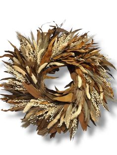 a dried wreath is shown on a white background