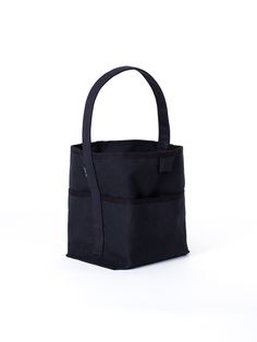 a black tote bag on a white background