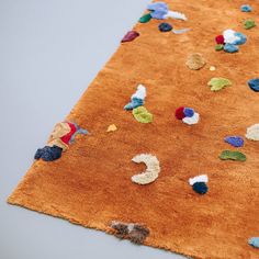 an area rug with various colored objects on it