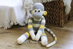 a stuffed monkey is sitting on the floor