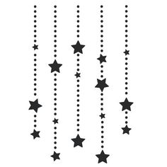 a black and white drawing of stars hanging from the side of a window sill