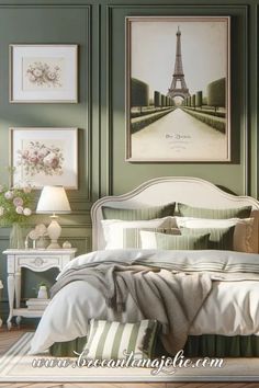 a bedroom with green walls and pictures on the wall above the bed in front of it