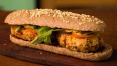 a close up of a sandwich on a cutting board