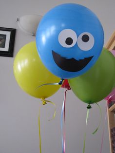 some balloons that have faces on them