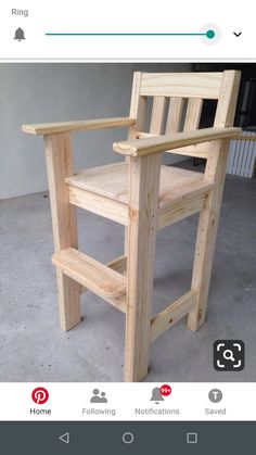 a wooden chair sitting on top of a cement floor