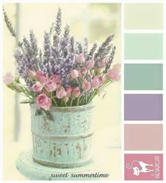 a vase filled with lots of pink flowers on top of a white table next to a color swatch