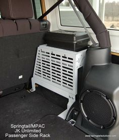 the interior of a vehicle with an entertainment system in the back seat and speakers on the side