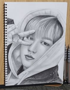 a pencil drawing of a person with a hoodie over their head and hands in the air