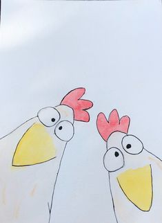 two chickens standing next to each other on top of a white paper with red and yellow feathers