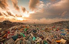 a pile of trash sitting on top of a beach