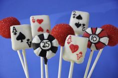 some kind of cake pops with playing cards on them