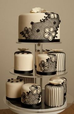 three tiered cake with black and white designs