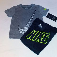 New With Tags, Nike Set Includes A Soft Lightweight Cotton Blend Grey With Black Trim Short Sleeve Tee Top With Classic Nike Swoosh Check Logo On Front And Left Sleeve In Volt. Bottoms Are Black Cotton Blend With Elastic Waistline With Nike Inscription On Left Side. Set Fits 2 Toddler Boys. Great Set For Any Occasion And Every Season. Thanks And Have A Great Day! Gray Playwear Sets For Summer, Gray Cotton Streetwear Sets, Black Graphic Print Playwear Sets, Black Graphic Print Sets For Playwear, Nike Black Summer Sets, Nike Girl Outfits, Athletic Fall, Nike Sweatsuit, Baby Boy Nike