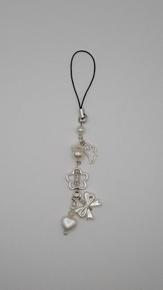 a necklace with charms hanging from it's side