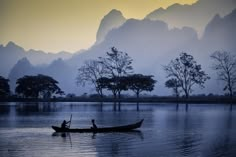 two people in a boat on the water