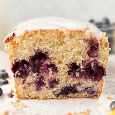 a close up of a piece of cake with blueberries on it