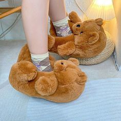 Cozy up in style with these adorable bear plush slippers. Made with soft, fluffy material, these slippers will keep your feet warm and comfortable all day long. The cute bear design adds a playful touch to these slippers, making them perfect for both kids and adults. Available in dark and light brown, you'll love slipping your feet into these fluffy slippers after a long day. One size fits most, so you can easily find a pair that fits comfortably on your feet. These animal slippers are perfect f Teddy Bear Shoes, Dark Brown Teddy Bear, Light Brown Teddy Bear, Bear Shoes, Fluffy Bear, Unicorn Slippers, Bear Slippers, Faux Fur Slides, Animal Slippers