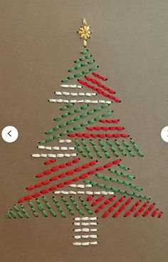 a christmas tree made out of toothpicks on top of a piece of paper