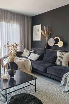 a living room filled with furniture and decor