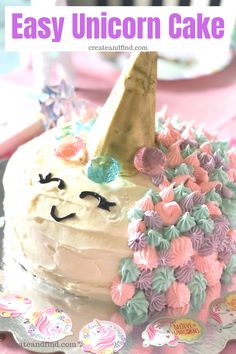 the cake is decorated with pastel flowers and an ice cream cone on top that says easy unicorn cake