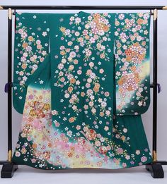 Cover yourself in a garden of flowers wearing this traditional Japanese silk Furisode kimono in teal green. Made of high quality silk threads. Beautiful to wear or as a room display. Item: Furisode Silk Kimono No. Syfu041 Size: US L-XL / Length 61 inch (155cm), Width 26 inch (67cm) Design : Floral Sakura cherry blossom. Condition: Used, Good. Please check the photos. Need a KIMONO RACK to hang this kimono? Find it here: https://www.etsy.com/listing/1303669853/kimono-rack-japanese-kimono-display- Teal Kimono, Kimono Traditional, Furisode Kimono, Green Kimono, Wedding Kimono, Japanese Dress, Japanese Silk, Long Kimono, Womens Kimono