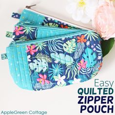 an easy quilted zipper pouch with flowers on the side and text overlay reading easy quilted zipper pouch