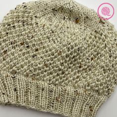 a close up of a knitted hat on a white surface with the words, free knitting pattern