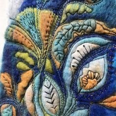 close up view of an embroidered piece of art