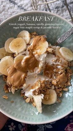 a bowl filled with granola, bananas and yogurt on top of it