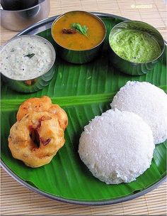 some food is sitting on a green plate