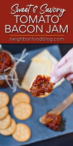 someone is holding up a piece of bacon jam from a baking sheet with crackers on the side