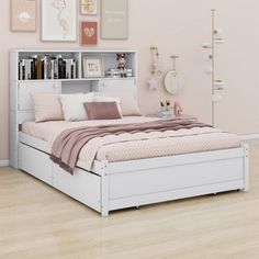 a white bed sitting in a bedroom next to a pink wall