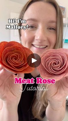 a woman holding up two pink flowers in front of her face with the words meat rose on it