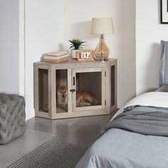 a bedroom with a bed, nightstand and side table