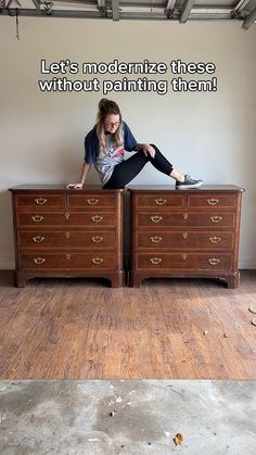 a woman sitting on top of a dresser next to a wall with the words let's modernize these without painting them