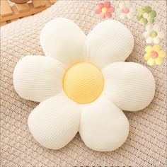 a white flower sitting on top of a table