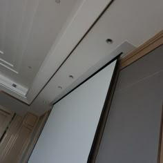 a projector screen mounted to the side of a wall