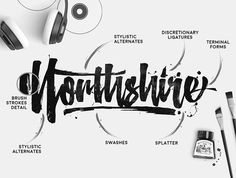 an artistic type of calligraphy that includes headphones, ink and marker pens on a white background