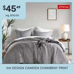 a bed with grey sheets and pillows on it for $ 45 95 reg $ 350 00