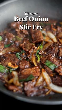 beef onion stir fry in a wok with onions and peppers on the side text reads 30 min beef onion stir fry