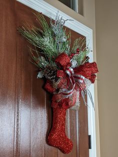 a christmas stocking hanging on the front door